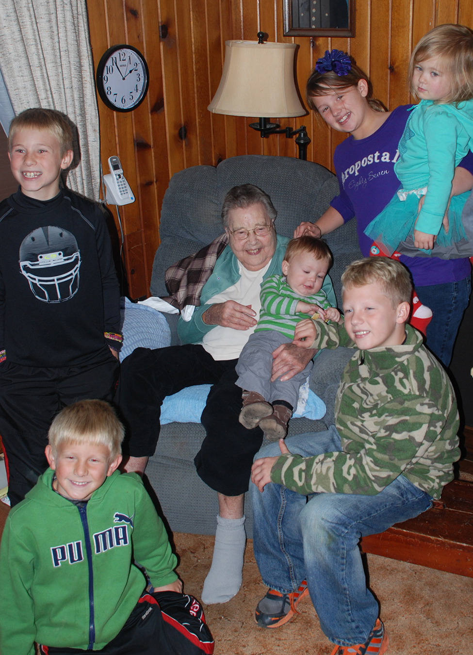 Photo of Mom with great-grandchildren