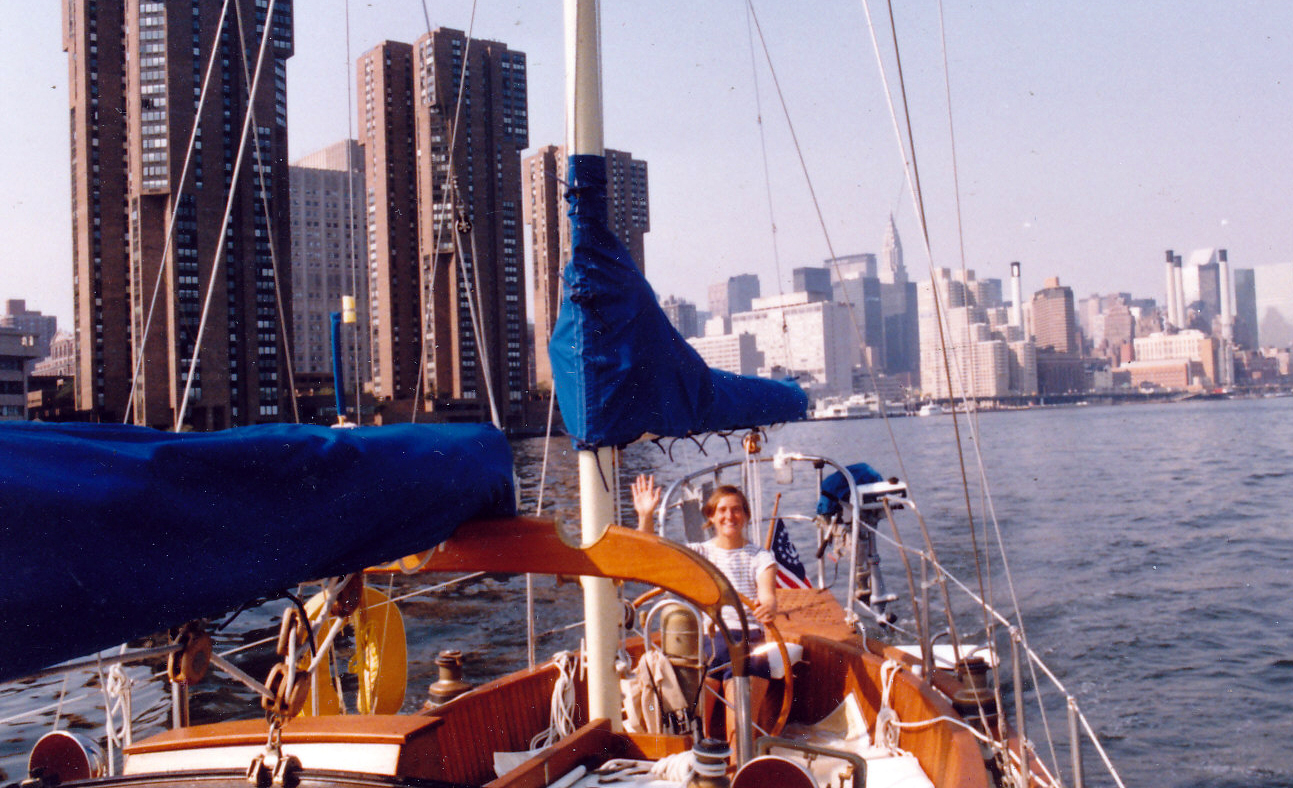 Photo of Judy motoring sailboat thru New York City