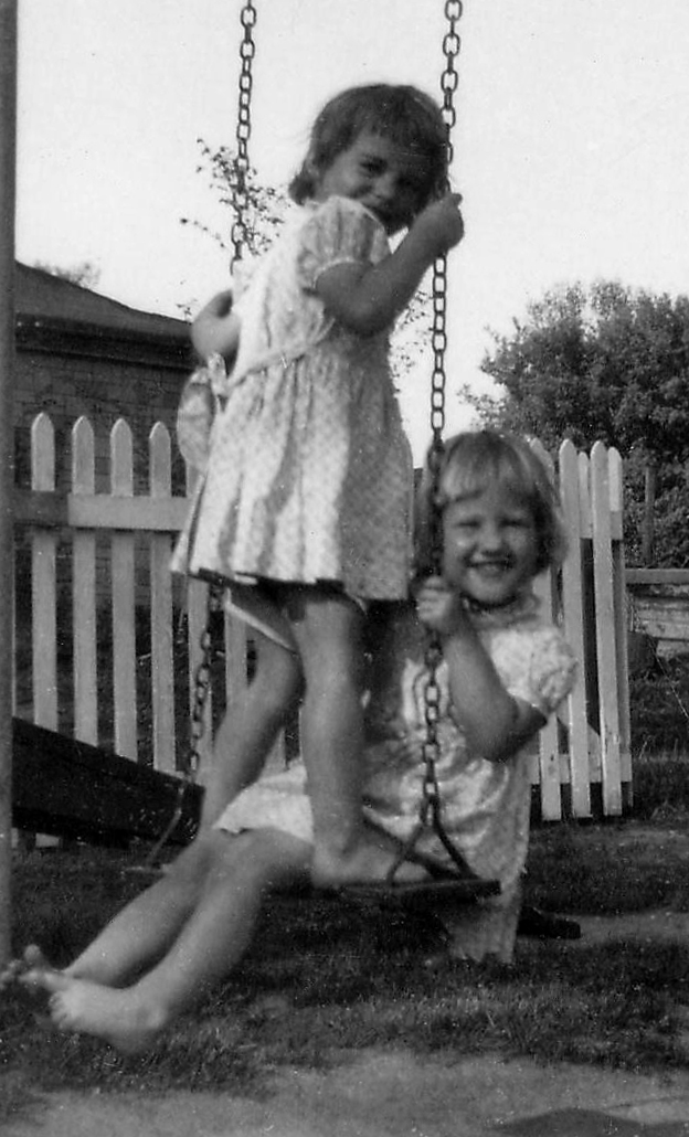 Photo of Linda and Leslie on a swing